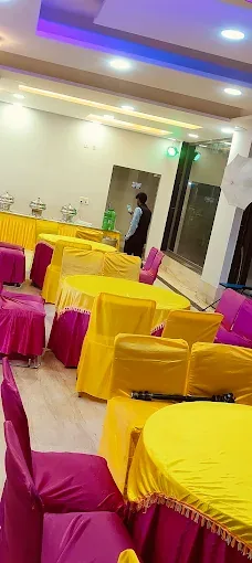 Colourful chair cover decoration by Shree Balaji Caterers