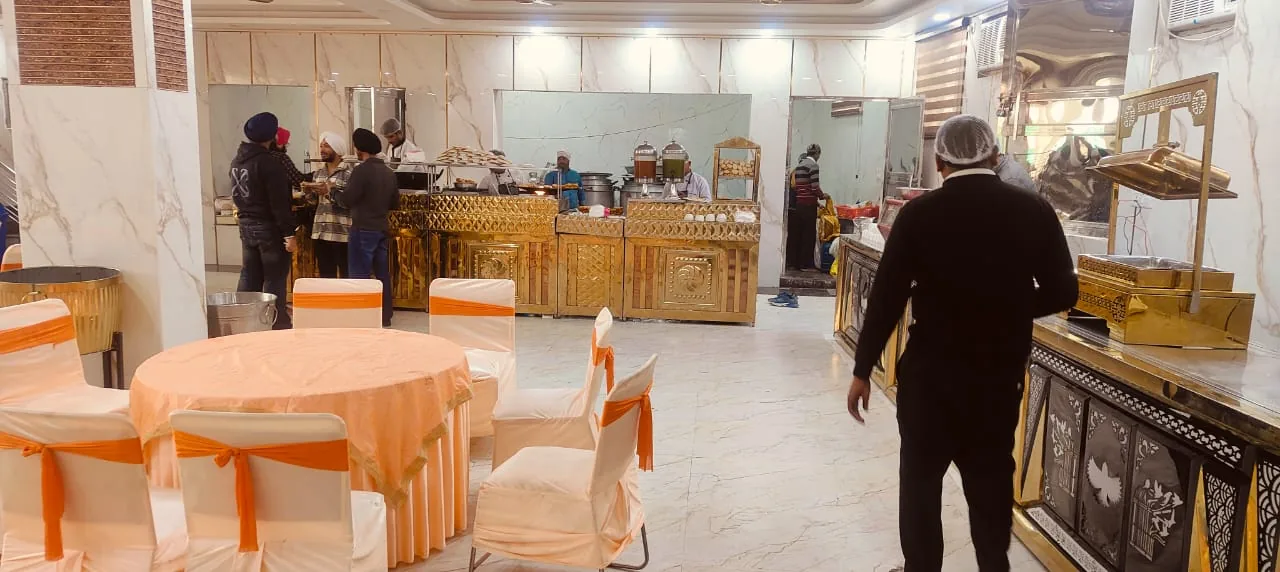 Indoor dining and buffet setup by Shree Balaji Caterers